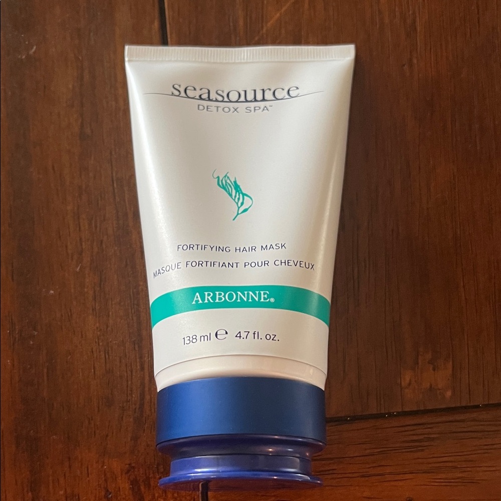 Arbonne Fortifying Hair Mask with Cream and Black Text